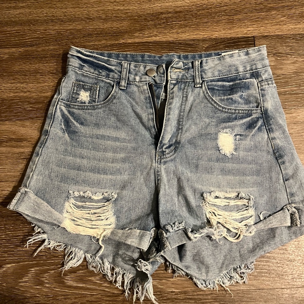 Light blue distressed denim shorts